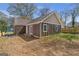 Rear exterior of home featuring a brown vertical siding at 1101 Oak Knoll Ter, Atlanta, GA 30315