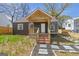 Charming home with a brick porch, exposed rafter tails and landscaped front yard at 1101 Oak Knoll Ter, Atlanta, GA 30315