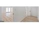 Hallway featuring wood floors and access to other areas of the home at 1101 Oak Knoll Ter, Atlanta, GA 30315
