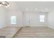 Bright living room with an entrance door, two windows, and modern flooring at 1101 Oak Knoll Ter, Atlanta, GA 30315