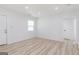 Bright living room with an entrance door, window, and modern flooring at 1101 Oak Knoll Ter, Atlanta, GA 30315