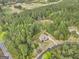 Serene aerial view of a home nestled amidst lush greenery, offering privacy and tranquility at 100 Chantilly Ln, Fayetteville, GA 30215