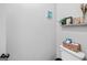 This half bathroom includes decorative items and a lovely color scheme at 100 Chantilly Ln, Fayetteville, GA 30215