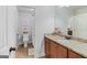 Bathroom featuring granite counters, updated vanity with double sinks, and walk-in shower at 100 Chantilly Ln, Fayetteville, GA 30215