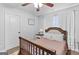 Bedroom features wood floors, natural light, ceiling fan and neutral paint at 100 Chantilly Ln, Fayetteville, GA 30215