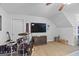 Entertaining bonus room area with a TV, mounted fan, and neutral wall-to-wall carpeting at 100 Chantilly Ln, Fayetteville, GA 30215