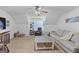 Relaxing bonus room featuring neutral color palette, comfortable furniture, and a ceiling fan at 100 Chantilly Ln, Fayetteville, GA 30215