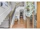 Grand foyer with staircase, wood floors, and views into the formal living areas at 100 Chantilly Ln, Fayetteville, GA 30215
