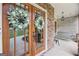 Close-up of front door featuring wreaths, stone accents, and a cozy porch swing at 100 Chantilly Ln, Fayetteville, GA 30215