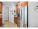Stainless steel refrigerator and wooden cabinets in the kitchen at 100 Chantilly Ln, Fayetteville, GA 30215