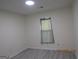 Bright bedroom with a skylight, neutral walls, and flooring at 1611 Cherry Hill Sw Ct, Conyers, GA 30094