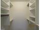 Walk-in closet with multiple shelves for optimal storage at 1611 Cherry Hill Sw Ct, Conyers, GA 30094