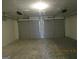 Spacious two car garage with automatic door openers and concrete floor at 1611 Cherry Hill Sw Ct, Conyers, GA 30094