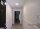 Bright hallway with neutral walls and tile floors leading to the living area at 1611 Cherry Hill Sw Ct, Conyers, GA 30094