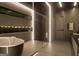Modern bathroom showcasing dark marble accents, a standalone tub, and a glass-enclosed shower for luxurious living at 2700 Antioch Ne St, Conyers, GA 30013