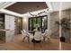 Elegant dining room with modern lighting, stylish decor, and a view of the outdoors at 2700 Antioch Ne St, Conyers, GA 30013