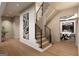 Inviting home entryway featuring hardwood floors, modern staircase, and stylish decor at 2700 Antioch Ne St, Conyers, GA 30013