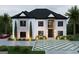 Elegant two-story home showcasing a white brick exterior, complemented by a well-manicured lawn and driveway at 2700 Antioch Ne St, Conyers, GA 30013