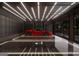 Luxurious garage with a sleek, modern design, featuring a stylish red sports car and elegant lighting at 2700 Antioch Ne St, Conyers, GA 30013