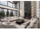 Bright and airy living room with high ceilings, large windows, and a cozy fireplace at 2700 Antioch Ne St, Conyers, GA 30013