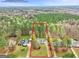 Aerial view of home with expansive backyard, surrounded by lush trees at 240 Sturgess Run, Sharpsburg, GA 30277