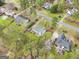Aerial view of the home and well-manicured backyard and neighboring residences at 240 Sturgess Run, Sharpsburg, GA 30277