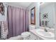 Standard bathroom with a shower curtain, toilet, and single vanity with a mirror at 240 Sturgess Run, Sharpsburg, GA 30277