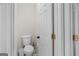 Powder room features a toilet, door, and neutral wall color at 240 Sturgess Run, Sharpsburg, GA 30277