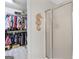 Bathroom featuring an open closet and a glass walk-in shower at 240 Sturgess Run, Sharpsburg, GA 30277