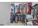Organized closet with shelving, clothing racks, and ample space for storage at 240 Sturgess Run, Sharpsburg, GA 30277