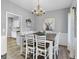 Elegant dining room with a rustic chandelier and stylish decor at 240 Sturgess Run, Sharpsburg, GA 30277