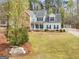 Charming two-story home with a brick facade and manicured lawn at 240 Sturgess Run, Sharpsburg, GA 30277