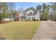 Beautiful two-story home with well-maintained lawn and landscaping at 240 Sturgess Run, Sharpsburg, GA 30277