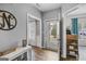 Bright foyer with wood-look floors, leading to various living spaces at 240 Sturgess Run, Sharpsburg, GA 30277