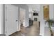 Hallway view to half bath and living room at 240 Sturgess Run, Sharpsburg, GA 30277