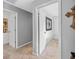Hallway with carpet and entryways to bedrooms in neutral colors at 240 Sturgess Run, Sharpsburg, GA 30277