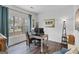 Bright home office with large window and wood-look flooring at 240 Sturgess Run, Sharpsburg, GA 30277