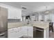Well-lit kitchen with granite counters, stainless steel appliances, and open view to dining area at 240 Sturgess Run, Sharpsburg, GA 30277