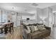 Inviting living room featuring a comfortable sofa, stylish decor, and an open layout with a breakfast bar at 240 Sturgess Run, Sharpsburg, GA 30277