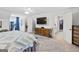 Large main bedroom with a dresser, television, carpet, and attached bath at 240 Sturgess Run, Sharpsburg, GA 30277