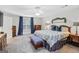 Large main bedroom with a bench, dresser, carpet, and a ceiling fan at 240 Sturgess Run, Sharpsburg, GA 30277