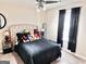 This cute bedroom features a neutral color scheme, a plush bed with stuffed animals and dark curtains at 3353 Medina Dr, Jonesboro, GA 30236