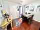 Bright dining room with hardwood floors, a neutral table setting and bright blue accents at 3353 Medina Dr, Jonesboro, GA 30236