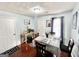 Bright dining room with hardwood floors, a neutral table setting and bright blue accents at 3353 Medina Dr, Jonesboro, GA 30236