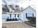 Charming single-story home with blue shutters, a covered porch, and well-maintained landscaping in the front yard at 3353 Medina Dr, Jonesboro, GA 30236