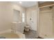 Bathroom featuring a jetted tub, standup shower and modern vanity at 351 Hemlock Ln, Locust Grove, GA 30248