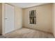 Calm bedroom featuring carpeted floors, a large closet and a window with a natural view at 351 Hemlock Ln, Locust Grove, GA 30248