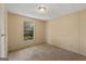 Neutral bedroom featuring plush carpeting, a bright window, and versatile design at 351 Hemlock Ln, Locust Grove, GA 30248