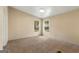 Bedroom featuring neutral walls and carpet with two windows to the outside at 351 Hemlock Ln, Locust Grove, GA 30248