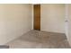Bedroom featuring neutral walls and carpet with a closet and doorway at 351 Hemlock Ln, Locust Grove, GA 30248